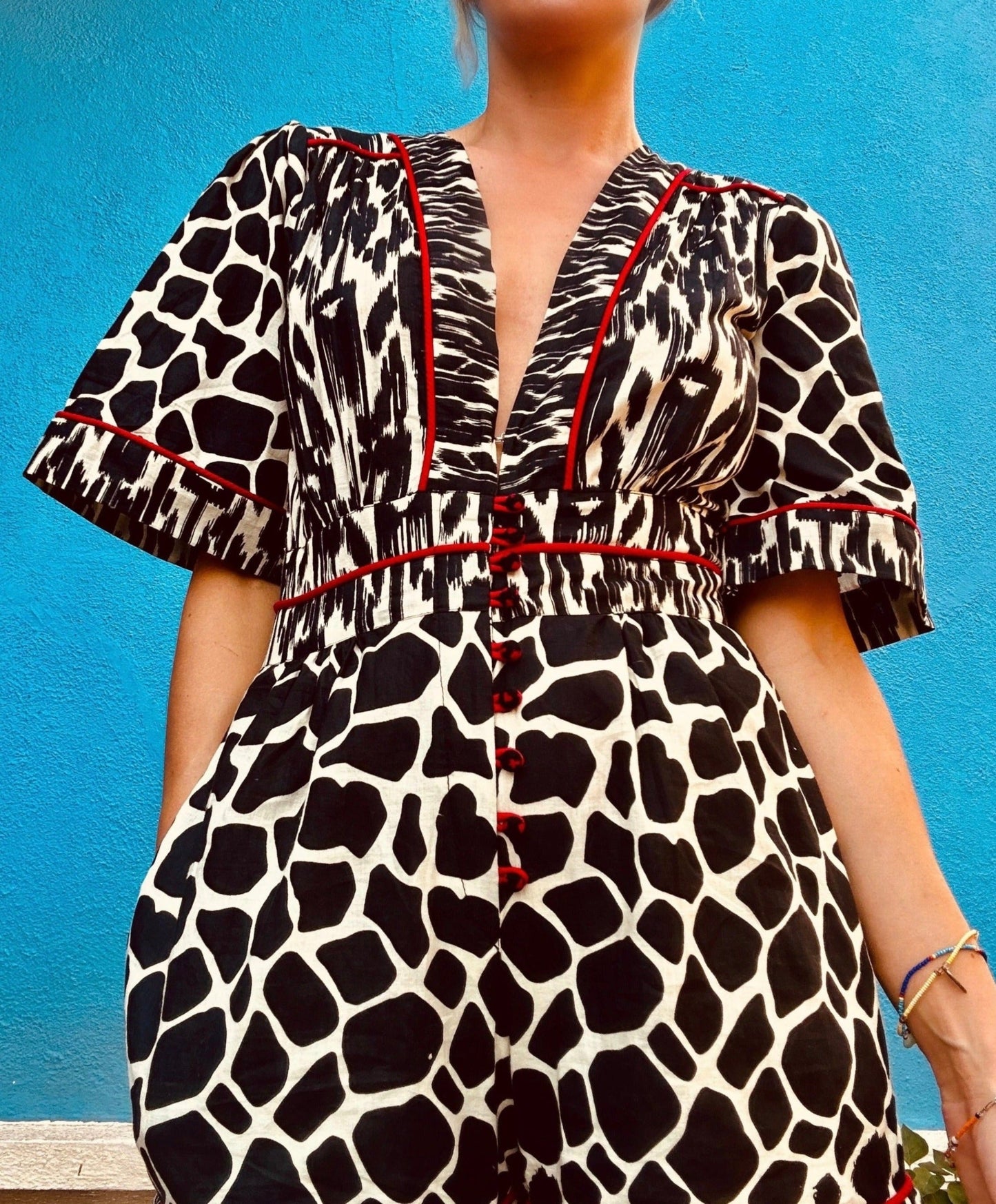 Plunging neckline romper in animal print with side pockets